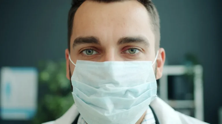 A healthcare professional wearing a face mask.
