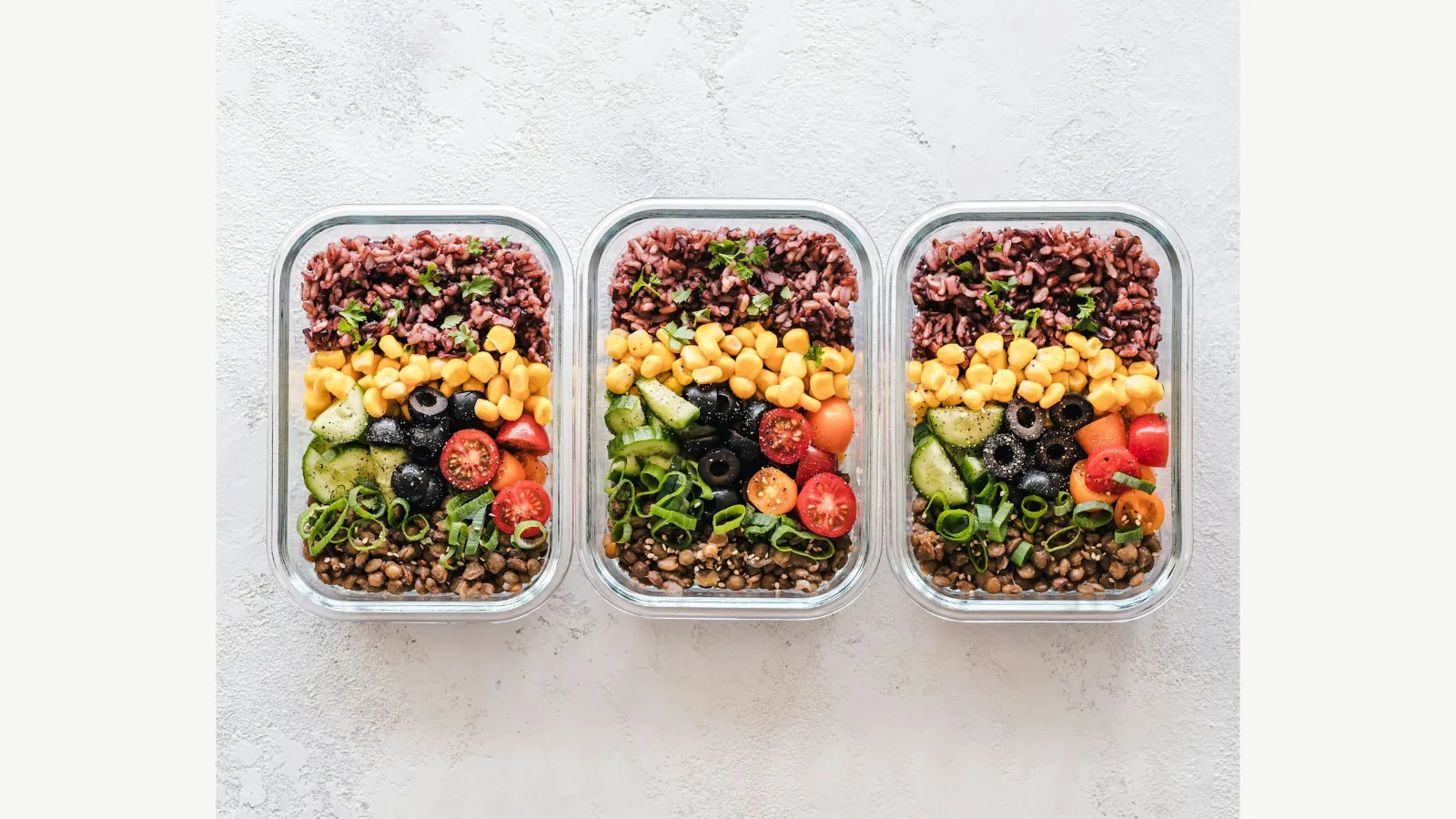 Containers of prepared vegetables and other meal ingredients.